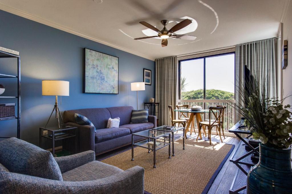 a living room with a couch and a table at Shipwatch 2373 in Kiawah Island