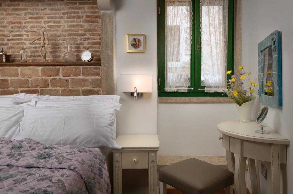 Posteľ alebo postele v izbe v ubytovaní Monterosso City Center