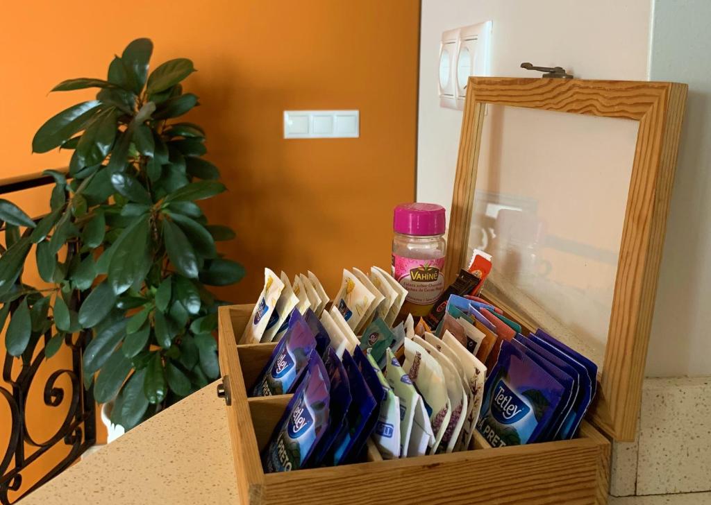 a wooden box filled with toothpaste and a mirror at Residence Lagos in Lagos