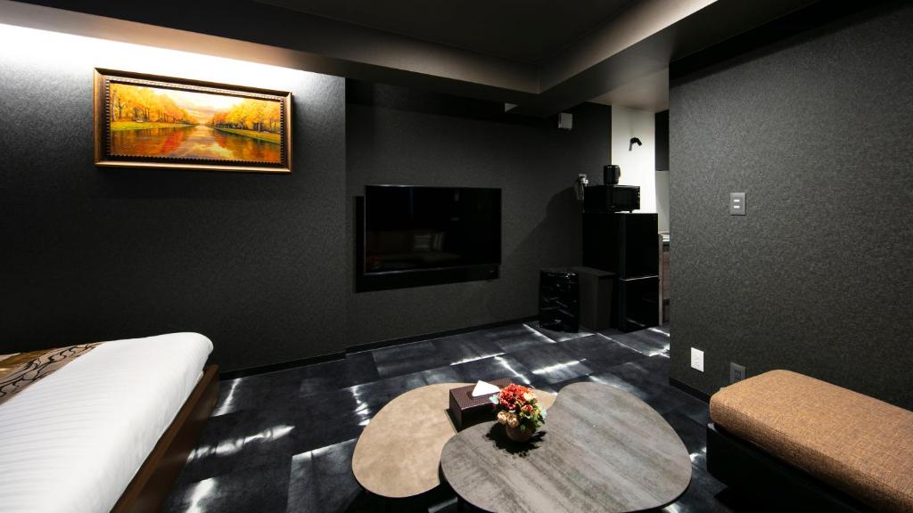 TV a/nebo společenská místnost v ubytování GRAND BASE Takamatsu
