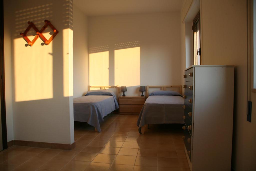 Postel nebo postele na pokoji v ubytování Casa Solento