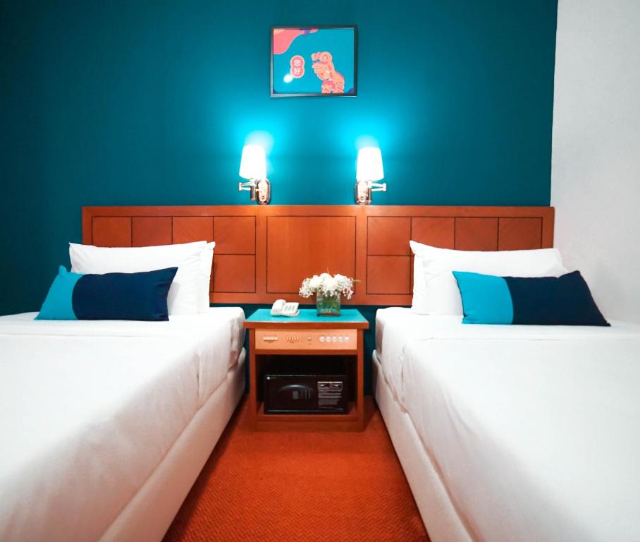 Postel nebo postele na pokoji v ubytování JO Hotel Johor Bahru