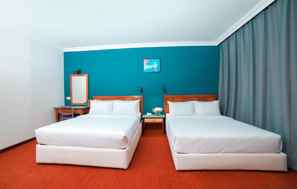 Postel nebo postele na pokoji v ubytování JO Hotel Johor Bahru