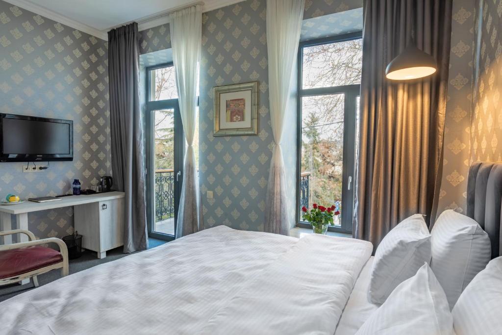 Postel nebo postele na pokoji v ubytování Hotel Day Inn