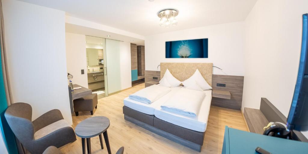 Postel nebo postele na pokoji v ubytování Hotel Sacher-Stoiber