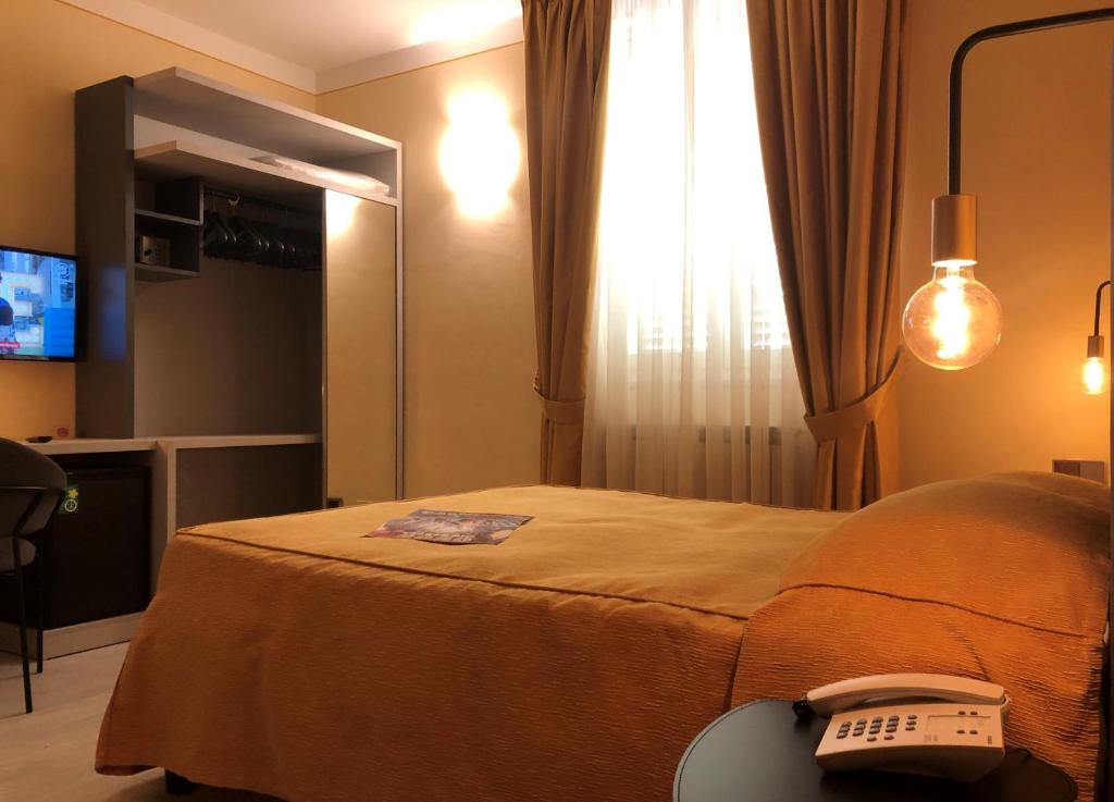 Postel nebo postele na pokoji v ubytování Hotel Tirrenia
