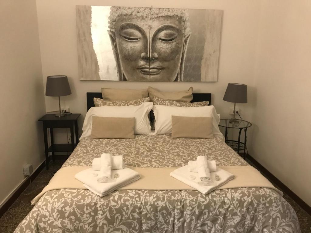 Postel nebo postele na pokoji v ubytování Domus La Foce Hotel
