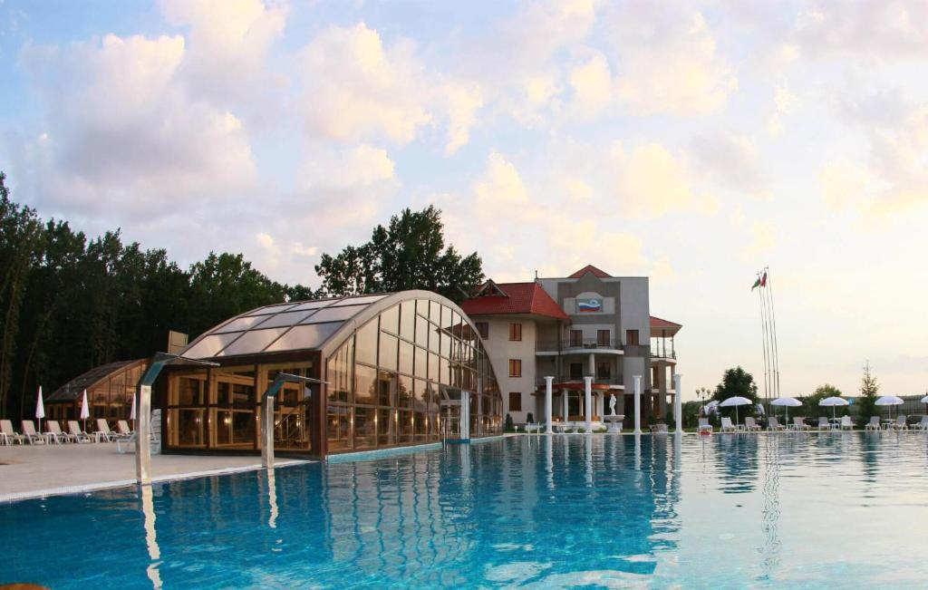 a rendering of a hotel with a swimming pool at Belogorye Hotel in Belgorod