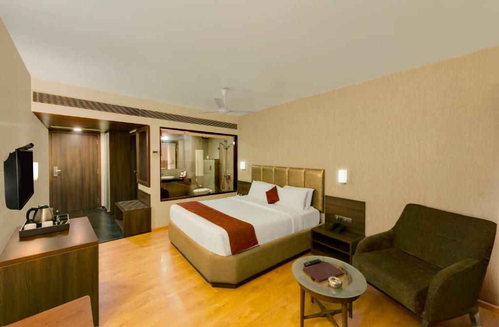 Central Beacon Hotel tesisinde bir odada yatak veya yataklar