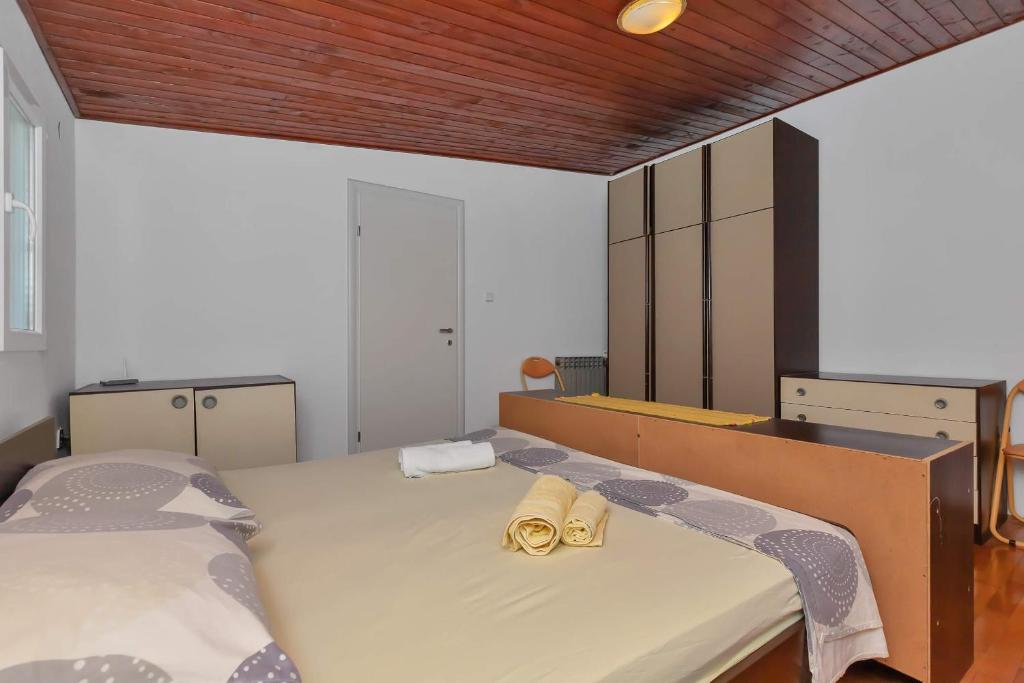 Postel nebo postele na pokoji v ubytování Apartments Vele