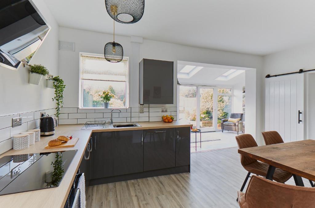 a kitchen with a counter and a dining room at The Nook in Huddersfield