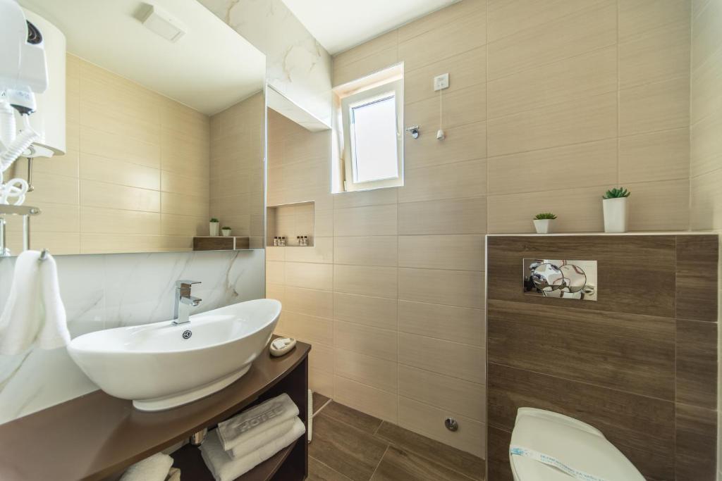 Koupelna v ubytování Garni Hotel President de Luxe
