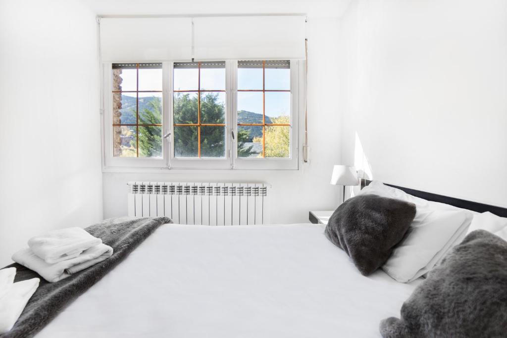 Postel nebo postele na pokoji v ubytování Apartaments Riu D'Incles