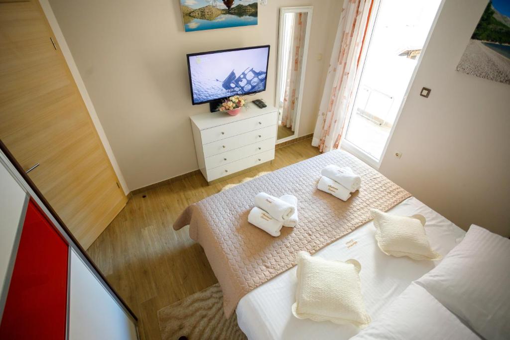Posteľ alebo postele v izbe v ubytovaní Apartment Centrum