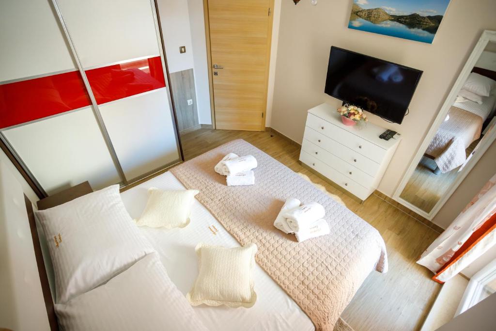 Posteľ alebo postele v izbe v ubytovaní Apartment Centrum