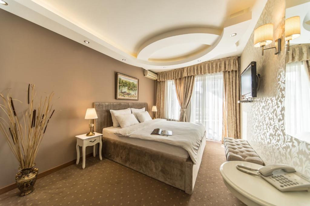 Postel nebo postele na pokoji v ubytování Garni Hotel President de Luxe