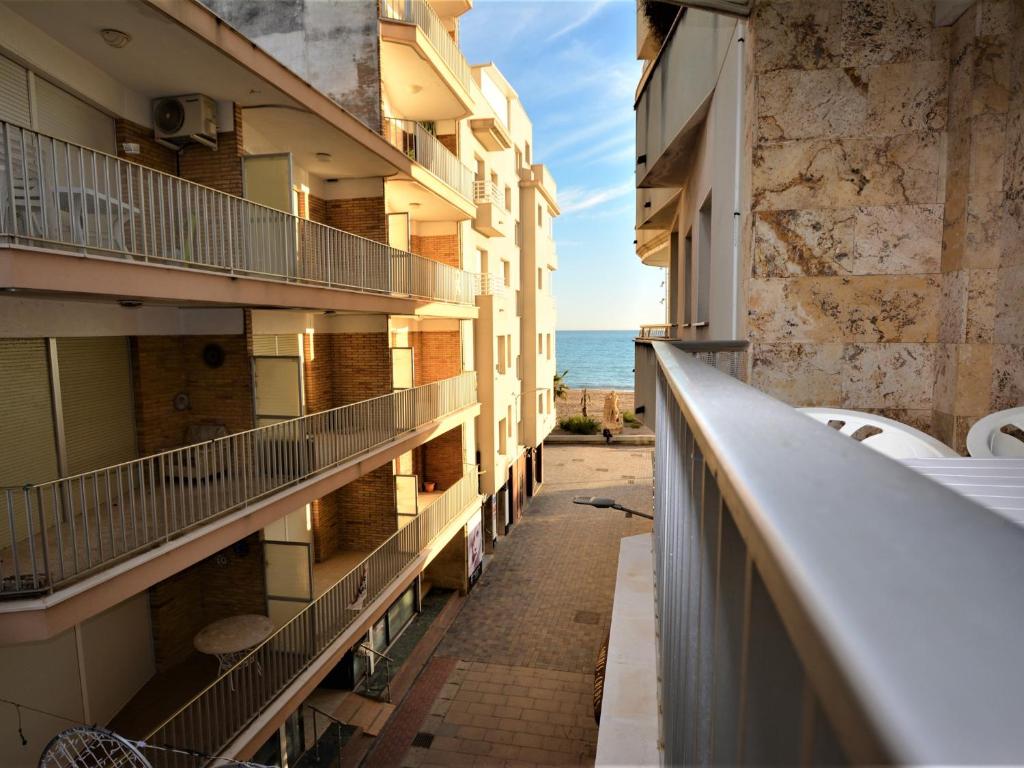 a balcony of a building with the ocean in the background at Villa Service - Suïssa 2 in Calafell
