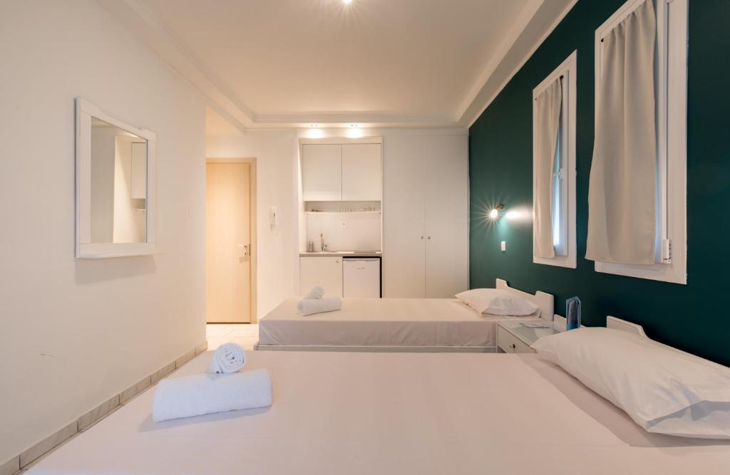 Postel nebo postele na pokoji v ubytování Hotel Melissanthi