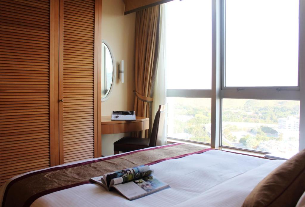 Postel nebo postele na pokoji v ubytování Harbour Plaza Resort City