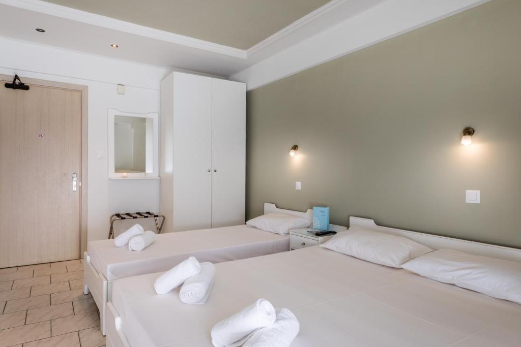 Postel nebo postele na pokoji v ubytování Hotel Melissanthi