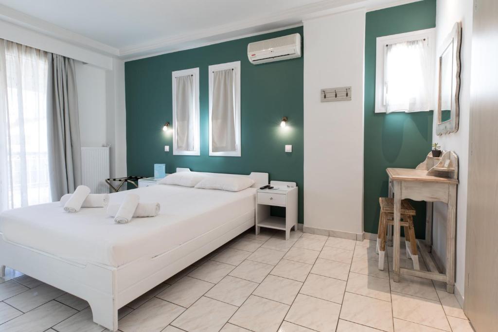 Postel nebo postele na pokoji v ubytování Hotel Melissanthi