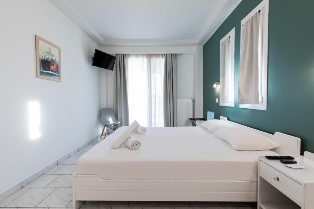 Postel nebo postele na pokoji v ubytování Hotel Melissanthi