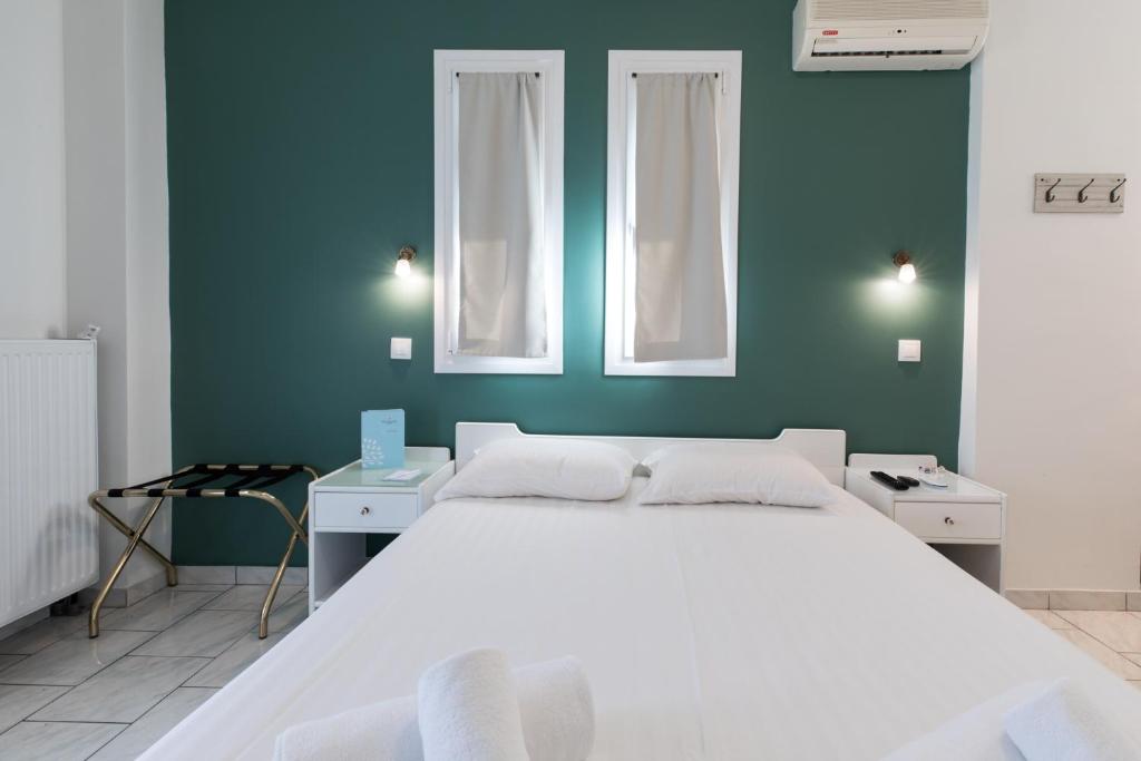 Postel nebo postele na pokoji v ubytování Hotel Melissanthi