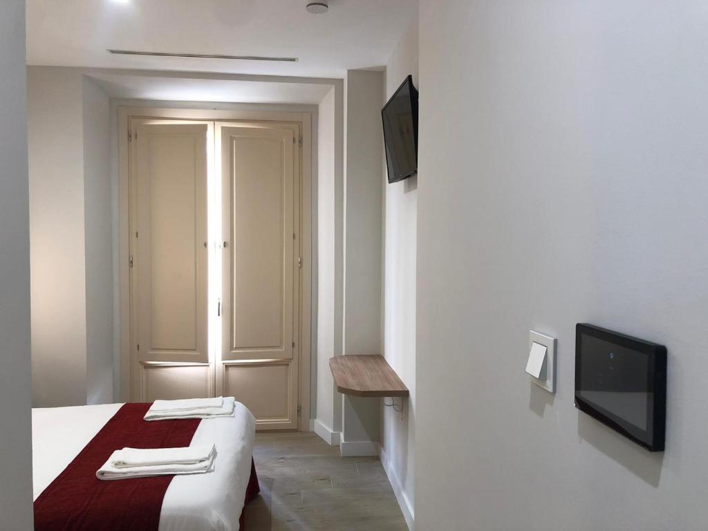 Posteľ alebo postele v izbe v ubytovaní Pinar Malaga Rooms
