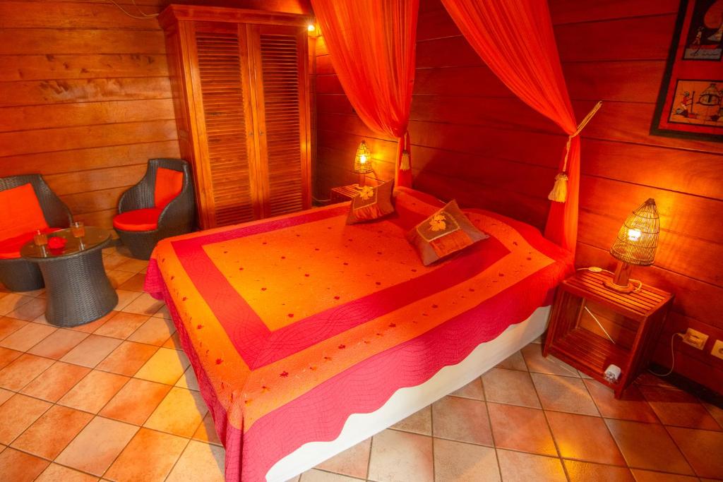 Postel nebo postele na pokoji v ubytování Baobab et Palmiers