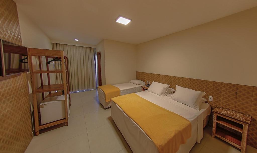 Postel nebo postele na pokoji v ubytování SunBahia Praia Hotel
