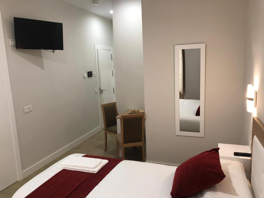 Posteľ alebo postele v izbe v ubytovaní Pinar Malaga Rooms