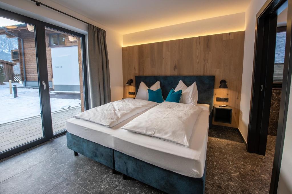 Posteľ alebo postele v izbe v ubytovaní Chalet's DAS DORF