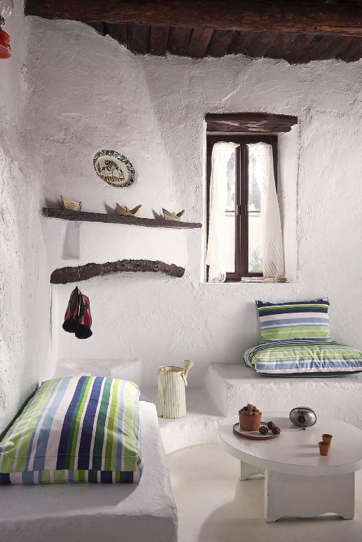 Posteľ alebo postele v izbe v ubytovaní Koutsounari Traditional Cottages