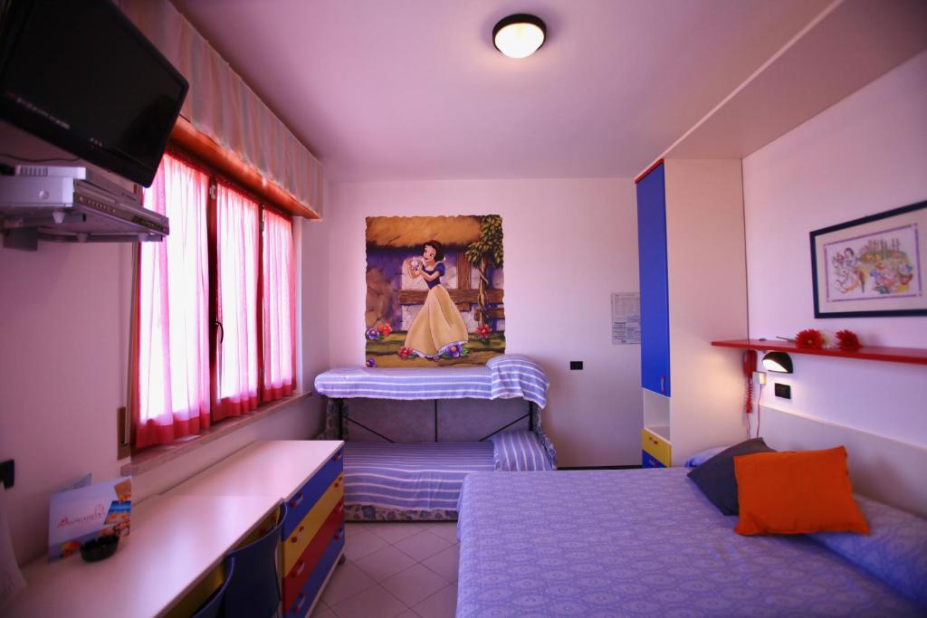 Postel nebo postele na pokoji v ubytování Hotel Biancaneve Wellness