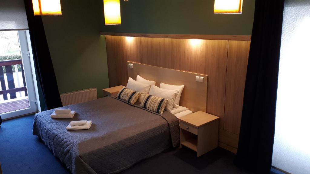 Llit o llits en una habitació de Alba Hotel