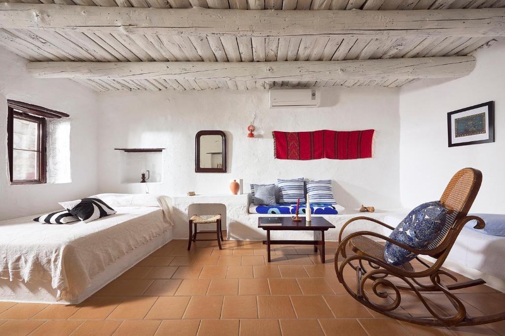 Posteľ alebo postele v izbe v ubytovaní Koutsounari Traditional Cottages
