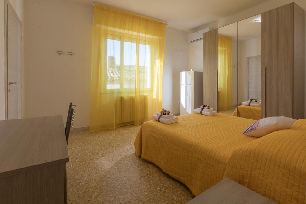 Posteľ alebo postele v izbe v ubytovaní B&B NONNO PEPPE
