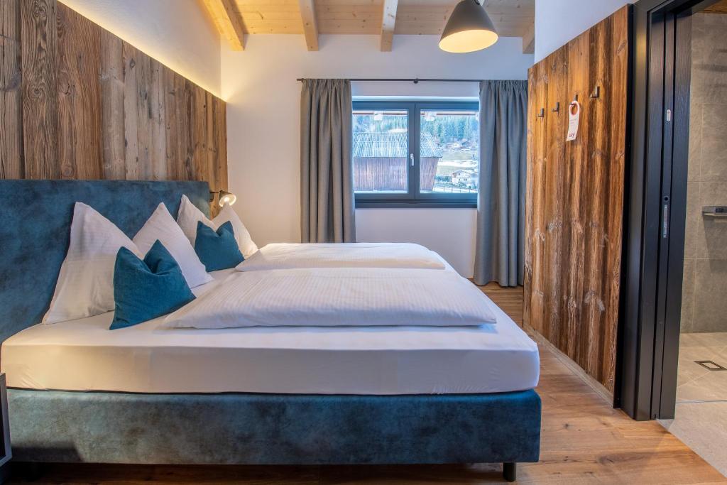 Posteľ alebo postele v izbe v ubytovaní Chalet's DAS DORF