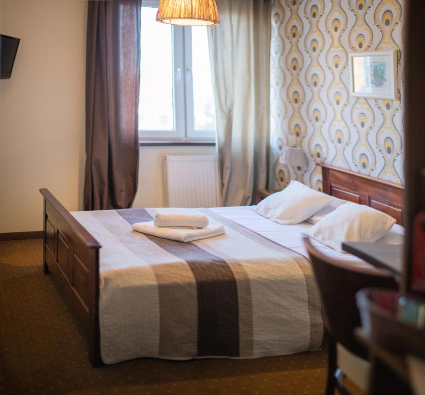 Postel nebo postele na pokoji v ubytování Pod Wzgórzem Bed & Breakfast