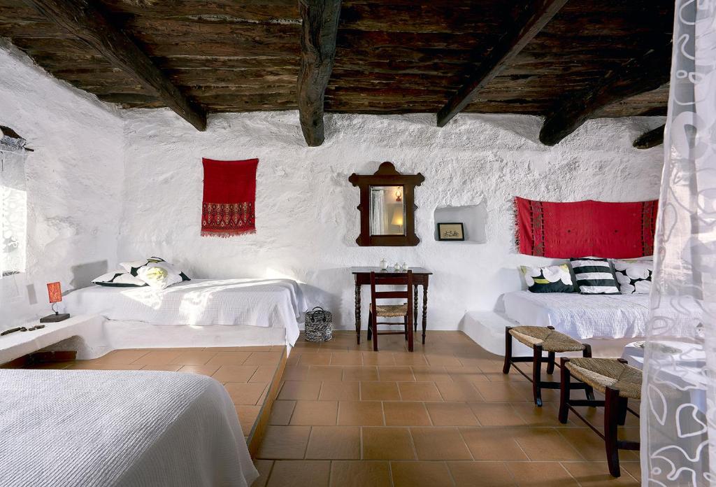 Posteľ alebo postele v izbe v ubytovaní Koutsounari Traditional Cottages