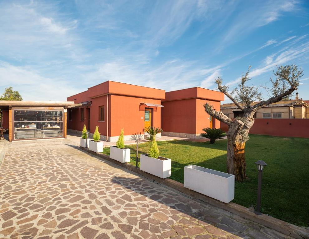 Vonkajšia záhrada v ubytovaní Domus Porto Di Traiano Resort