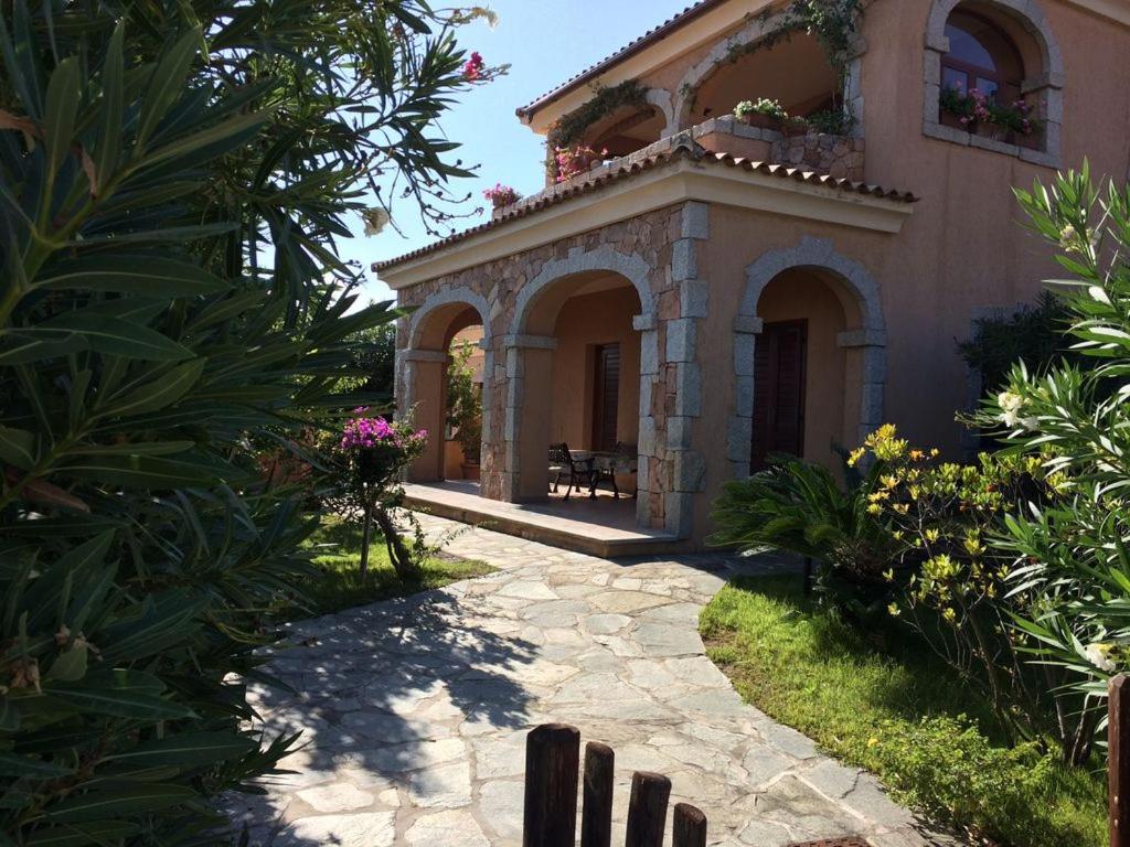 A garden outside Villa Oleandro - 2349447