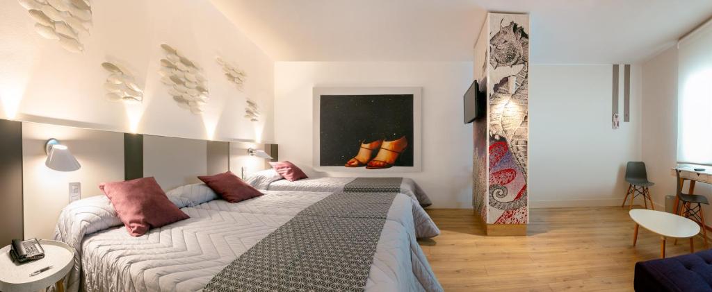 Postel nebo postele na pokoji v ubytování Hotel Olympus