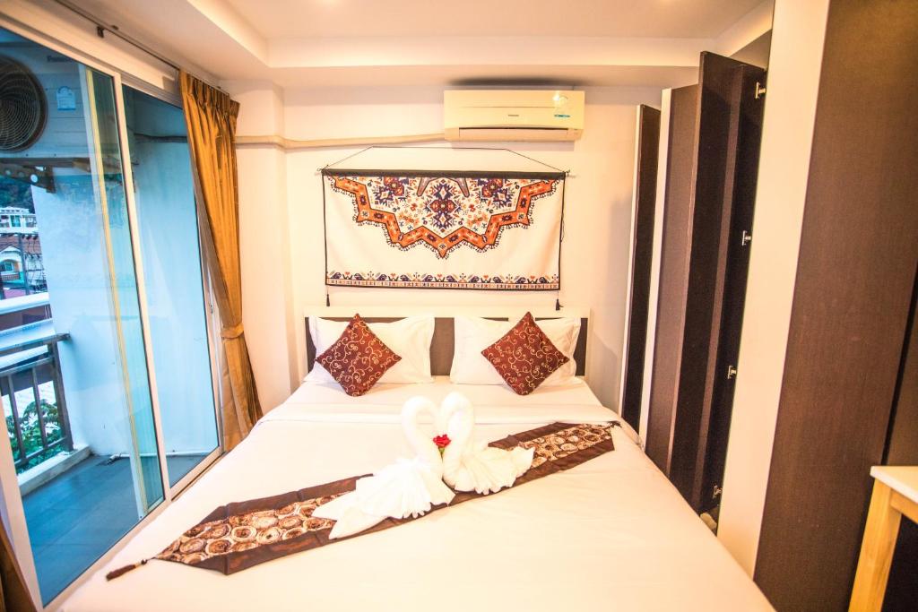Postel nebo postele na pokoji v ubytování Happy 99 Guest house