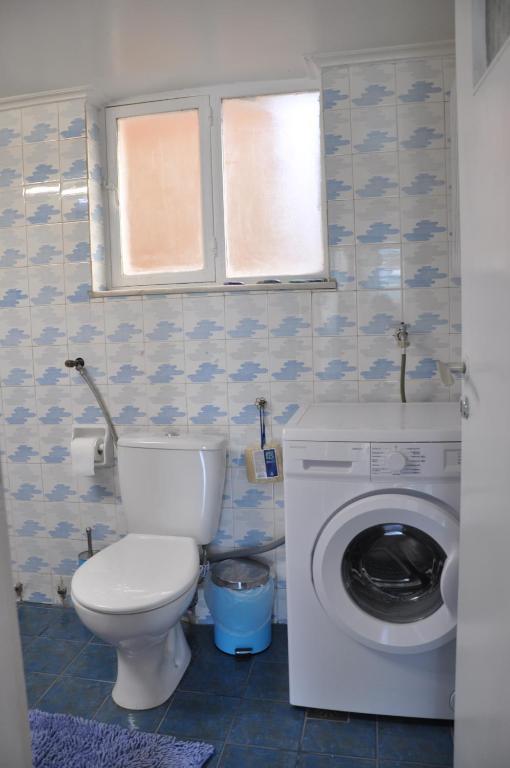 A bathroom at Sunny Apartment with view