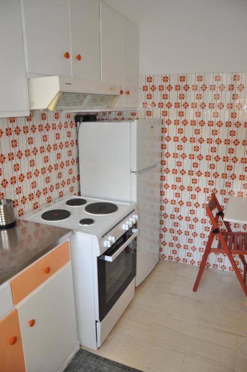 A kitchen or kitchenette at Sunny Apartment with view