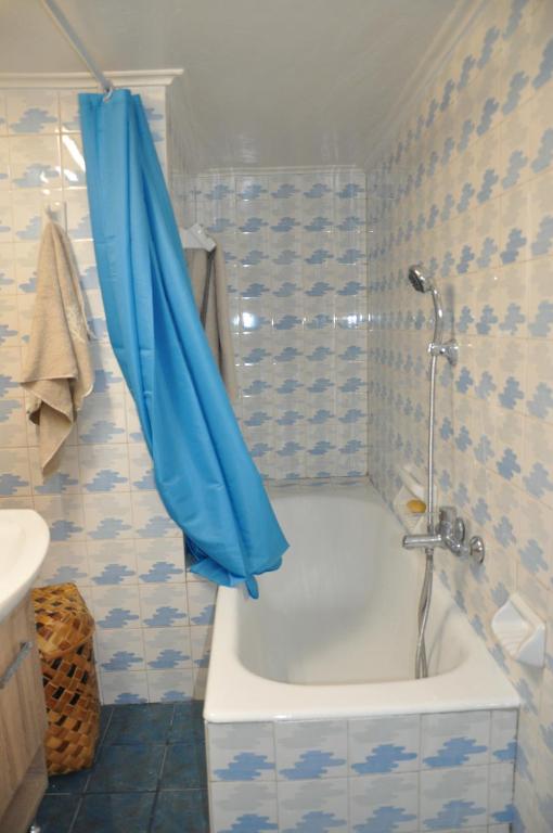 A bathroom at Sunny Apartment with view