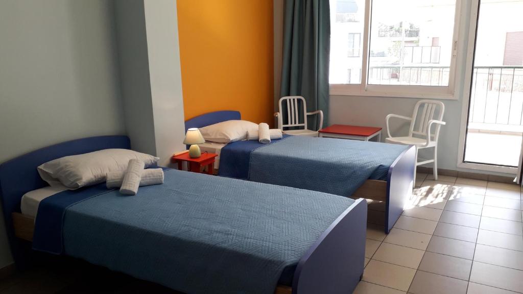 Ένα ή περισσότερα κρεβάτια σε δωμάτιο στο Welcommon Hostel