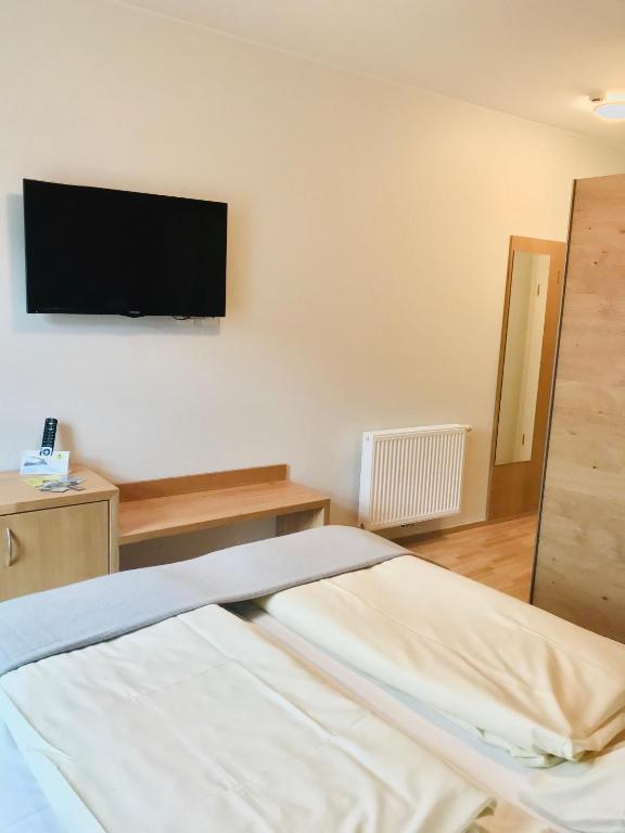 Postel nebo postele na pokoji v ubytování Hotel-Restaurant Zum Onkel Jonathan