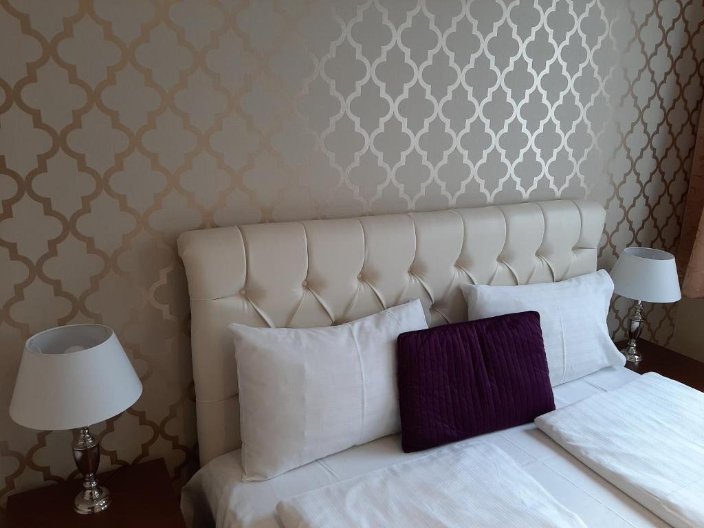 Ένα ή περισσότερα κρεβάτια σε δωμάτιο στο Trendy Deluxe Apartments